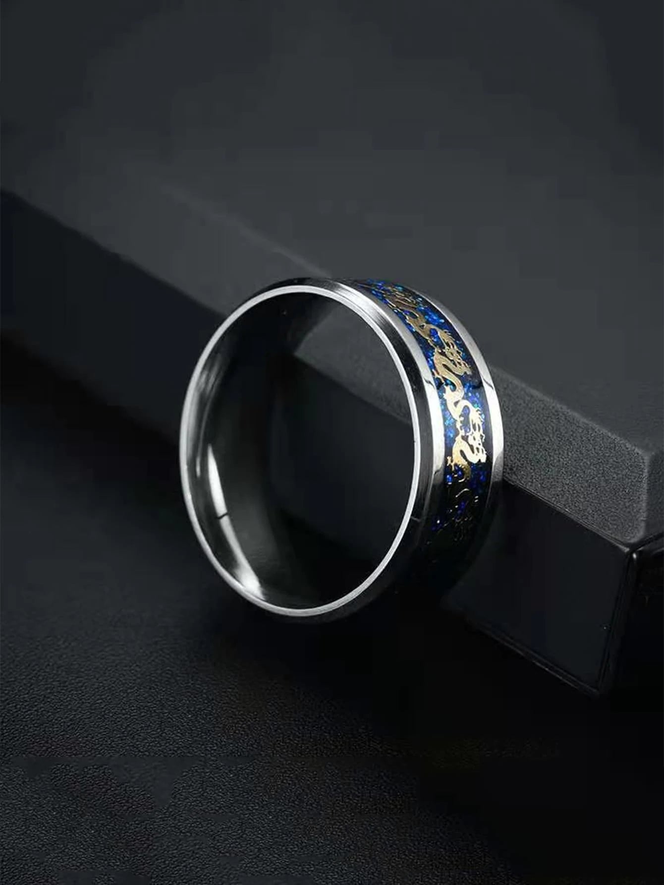 Silver and blue ring with dragon detail