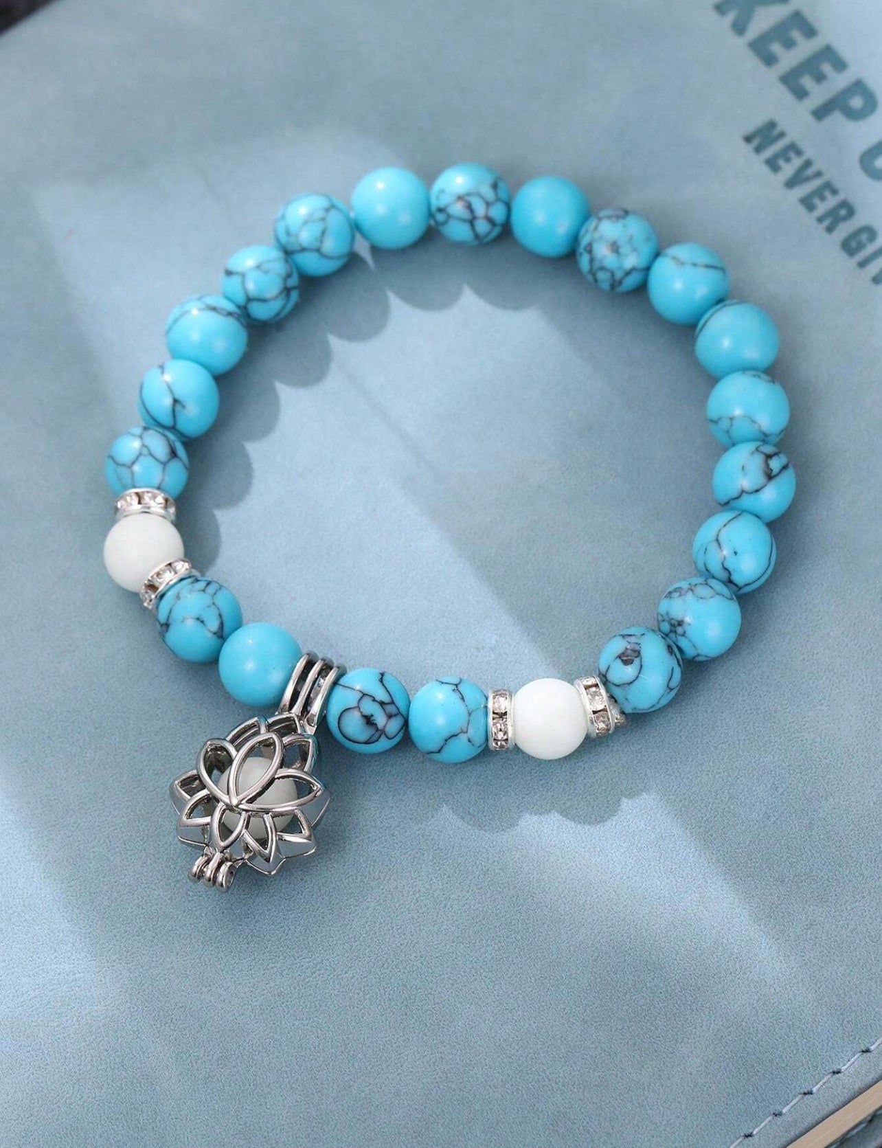Dark shiny bead bracelet with flower accessory