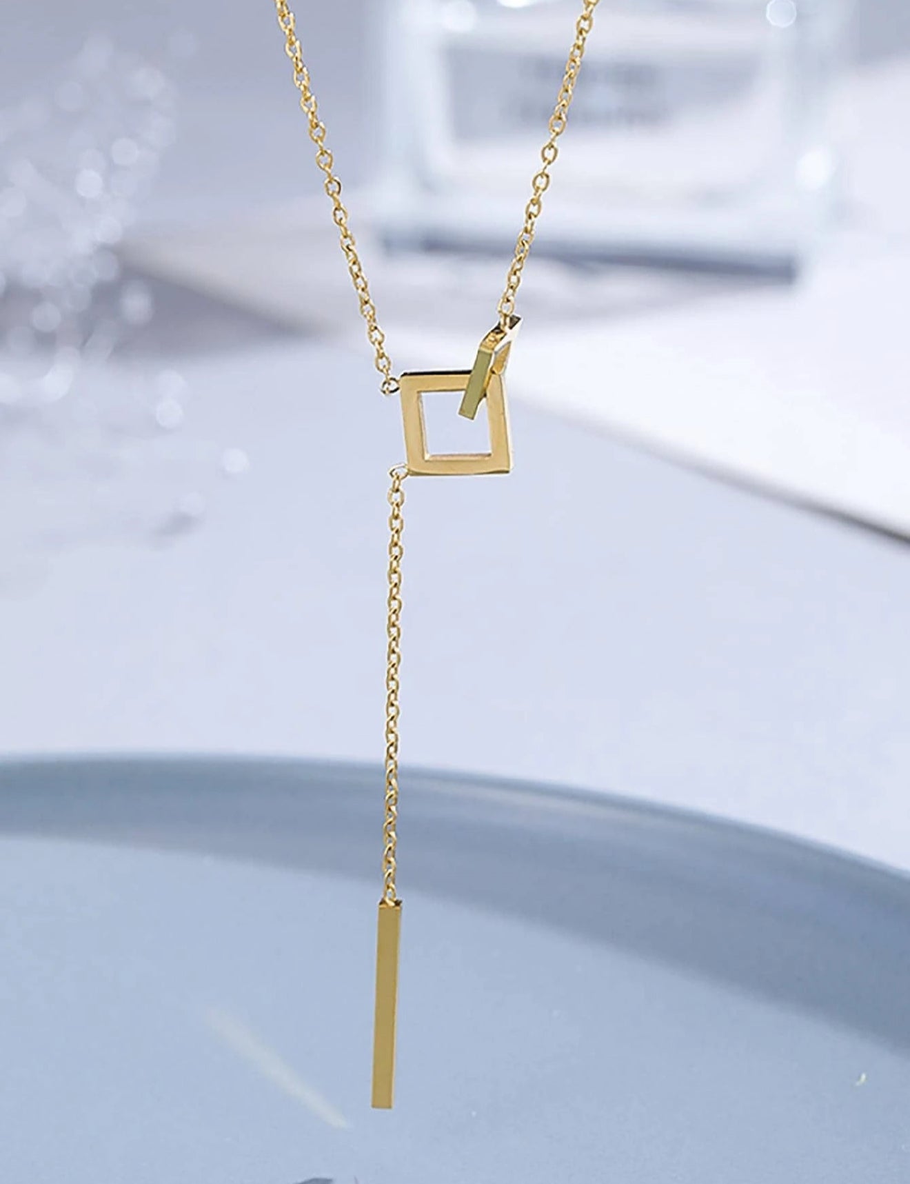 Mia Collar dorado en acero inoxidable con dijes geométricos