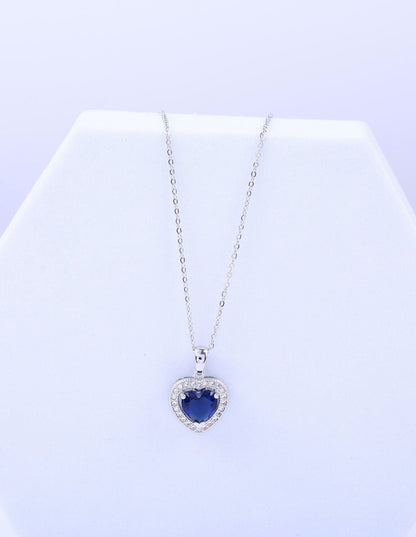 Mia Collar con dije de corazón y piedra azul en acero inoxidable
