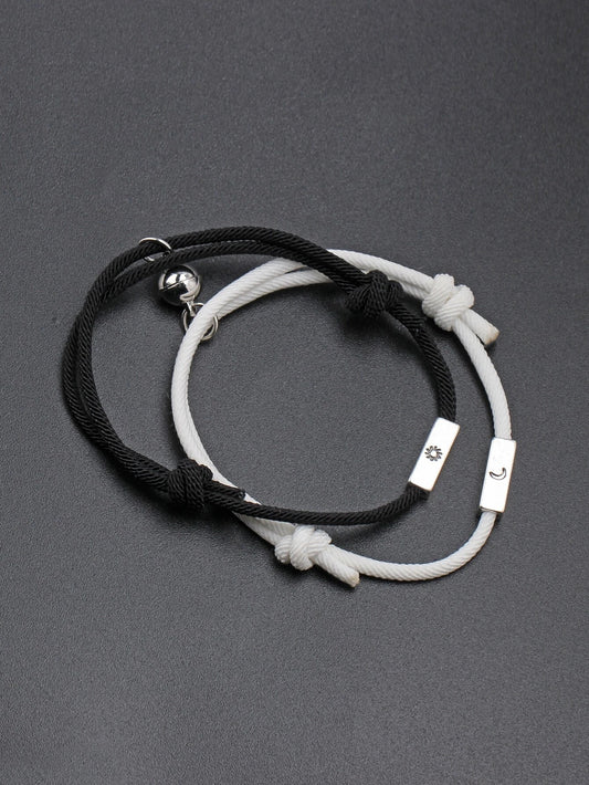 Couples bracelet with moon and sun detail in black and white 2 pieces