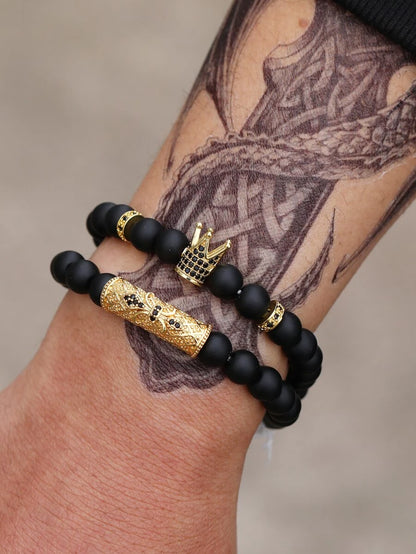 2-piece bracelet with black bead with golden crown